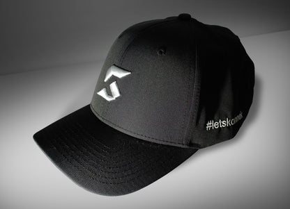 Black cap with konnek sports logo and text on a gray background