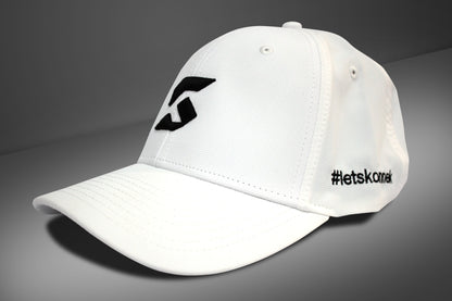 White cap with black konnek sports logo and text on a gray background